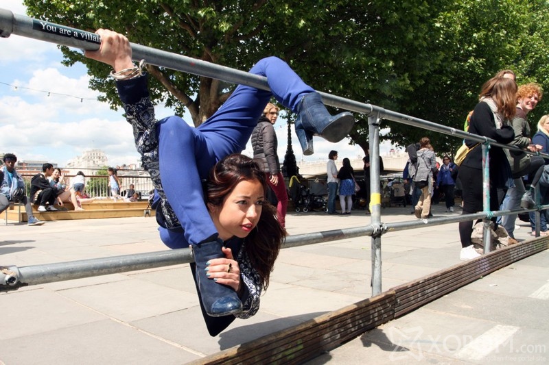 *** EXCLUSIVE - VIDEO AVAILABLE *** LONDON, UNITED KINGDOM - MAY 30: Leilani Franco, 29, hooks her body around the metal barrier, on May 30, 2015, in London, England. SUPPLE Londoner Leilani Franco is so bendy she can fold herself into a carry-on suitcase. The 29-year-old amazes onlookers by effortlessly fitting her body into hand-held luggage. And Leilani, a professional contortionist, also holds the record for the fastest backbend walk and the fastest contortion roll. PHOTOGRAPH BY David Waldman / Barcroft Media UK Office, London. T +44 845 370 2233 W www.barcroftmedia.com USA Office, New York City. T +1 212 796 2458 W www.barcroftusa.com Indian Office, Delhi. T +91 11 4053 2429 W www.barcroftindia.com