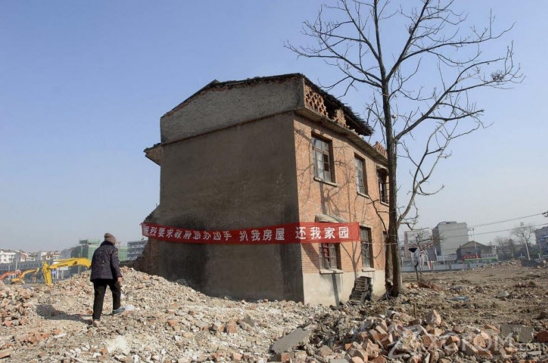 Бүтээн байгуулалтын замд хөндөлсөх Хятадын байшингууд 12